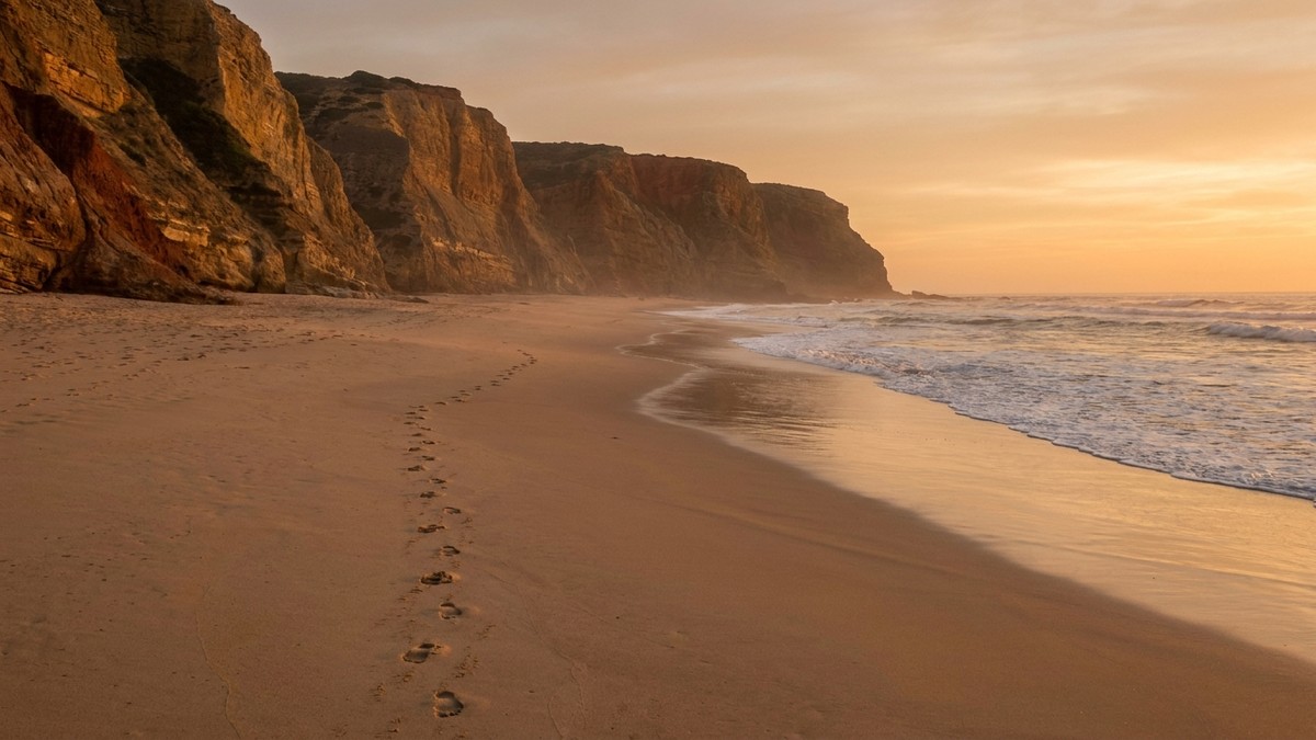 A quiet Costa Vicentina beach glowing in golden autumn light